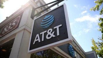 A sign is connected to an AT&T Store showing the famous ball logo and AT&T wordmark.